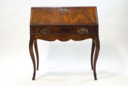 A 19th century walnut ladies writing desk in the Louis XVI style,