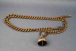 A yellow metal graduated albert chain with Tbar.
