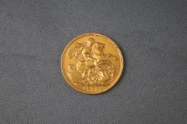 A full gold Sovereign coin, 1909. 8.