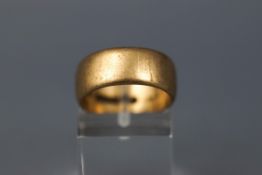 A yellow gold D shape wedding ring, 8.00mm shank. Hallmarked 9ct gold, Birmingham.