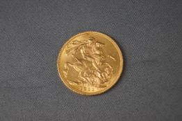 A full gold Sovereign coin, dated 1911. 8.