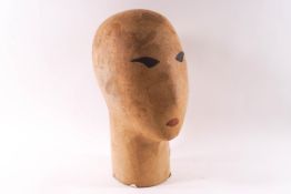 A mannequin head hat stand with painted facial features, 32.