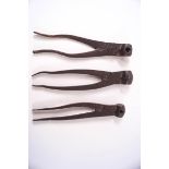 Three metal scissor action musket shot moulds of varying size