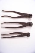 Three metal scissor action musket shot moulds of varying size