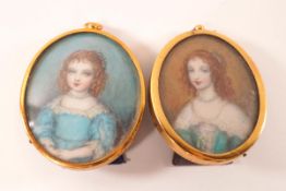 A pair of 20th century oval miniature portraits on ivorine,