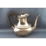 A silver coffee pot, with ebony knop and handle, and half reeded body, by Mappin and Webb,