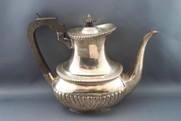 A silver coffee pot, with ebony knop and handle, and half reeded body, by Mappin and Webb,