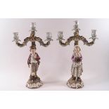 A pair of Continental Sitzendorf style porcelain three branch candelabra,