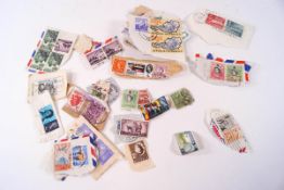 A collection of loose All World stamps