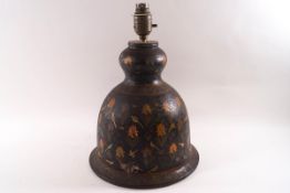 An Indian papier mache table lamp, painted with flowers and birds on a black ground,