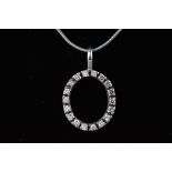 A modern white gold oval pendant set with eighteen round brilliant diamonds,