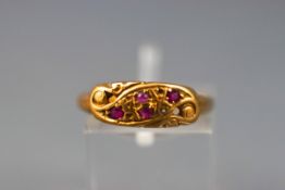 A yellow gold ruby and diamond crossover dress ring (some diamonds missing).
