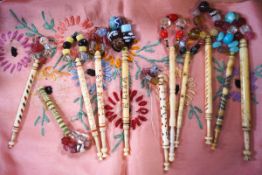 A collection of eleven 19th century bone lace bobbins with glass spangles,