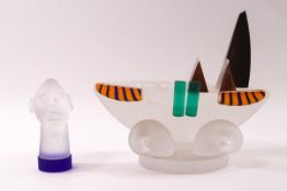 A Borowski Glasstudio model of a boat with a head of a man to the centre, a circular stand,