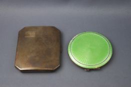 A silver and green enamel powder compact, with engine turned decoration, the reverse engraved "B.P.
