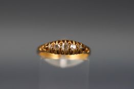 A yellow gold half hoop ring. Set with five graduated old brilliant cut diamonds.