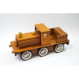 A handmade cherrywood push along toy train,