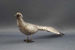 A silver plated figure of a pheasant, with red glass eyes, 6.