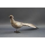 A silver plated figure of a pheasant, with red glass eyes, 6.