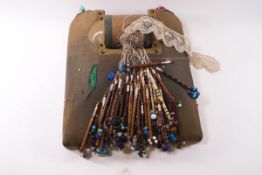 A large quantity of Victorian wooden and bone lace bobbins with glass spangles,
