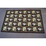 A mid-20th century wool needlepoint rug,