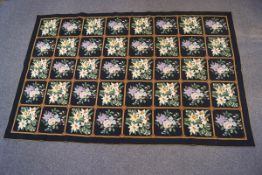 A mid-20th century wool needlepoint rug,