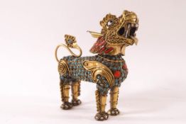 A Chinese gilt metal and inset hardstone scent bottle, modelled as a figure of a Dog of Fo,