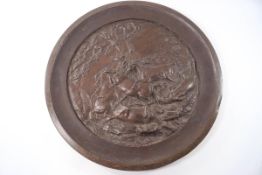A large bronze charger depicting five horses fighting, signed H W M Caithy(?),