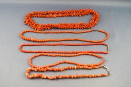 A collection of coral necklaces consisting of beads and abstract shapes. Gross weight; 109.