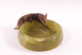 An early 20th century onyx ashtray with cold painted bronze fox,