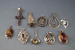 A selection of ten pendants consisting of gem set and plain. All stamped 925 for sterling silver.
