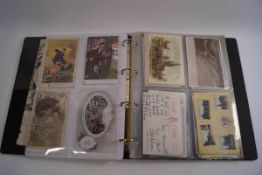 Various Victorian and early 20th century postcards within two albums, including humorous, sporting,