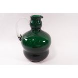 A 19th century cut glass jug, the faceted body bearing various shapes,