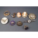 A selection of items consisting of : four sterling silver brooches of abstract design,