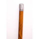 A 1930's sectional walking cane with white metal tip, unscrewing to reveal a small drinking phial,