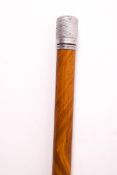 A 1930's sectional walking cane with white metal tip, unscrewing to reveal a small drinking phial,