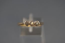 A 9ct gold and diamond three stone ring, the graduated round brilliants approx. 0.