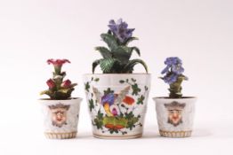 Three miniature Dresden porcelain flower pots, the largest painted with insects and exotic birds,