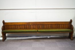 A large Victorian pine church pew,