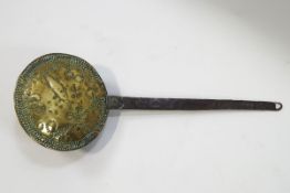 A 17th century Anglo Dutch brass warming pan with wrought iron handle and punched decoration to the