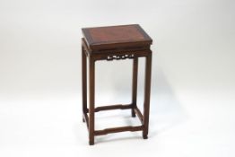 A Chinese hardwood occasional table with burr wood top on slender legs,