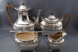 A Victorian four piece silver tea set, comprising of a hot water jug, a teapot,