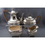 A Victorian four piece silver tea set, comprising of a hot water jug, a teapot,