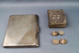 A silver cigarette case, with engine turned decoration,