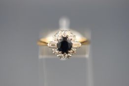 An 18ct gold, sapphire and diamond cluster ring,