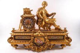 A large French gilt metal mantel clock with painted porcelain dial and panels,