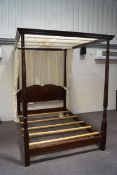 A 20th century mahogany four poster double bed,