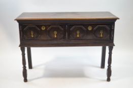 An 18th century style oak dresser base with two drawers, 81cm high x 118cm wide x 47.