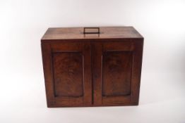A 19th century flame mahogany table top cabinet of eight drawers, possibly a surgeon's chest,