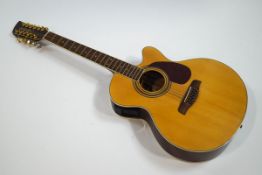 A Brunswick semi-acoustic twelve string guitar (one string missing), model No BTK6012N,